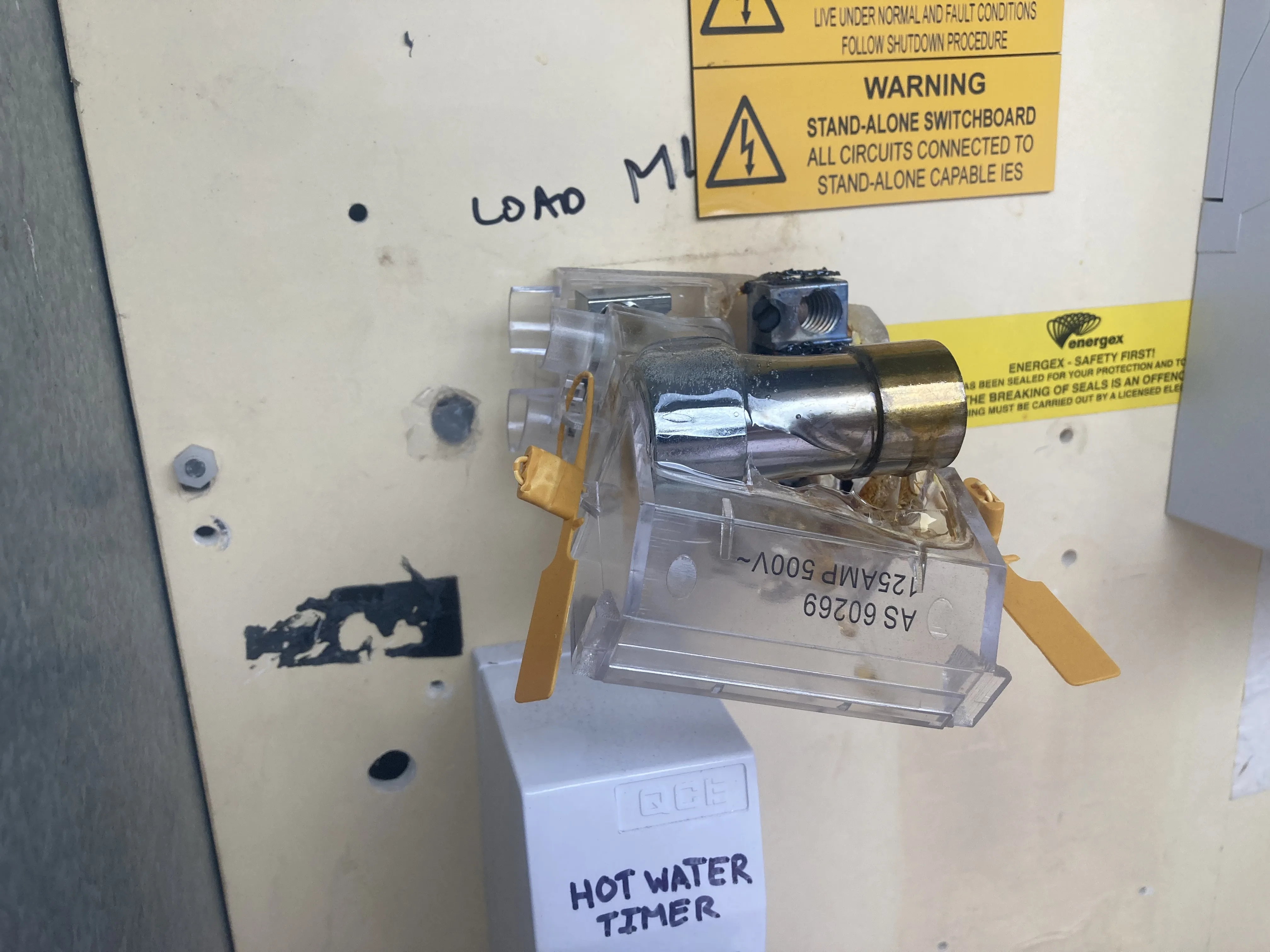 Melted Energex sealed isolation link in a residential switchboard